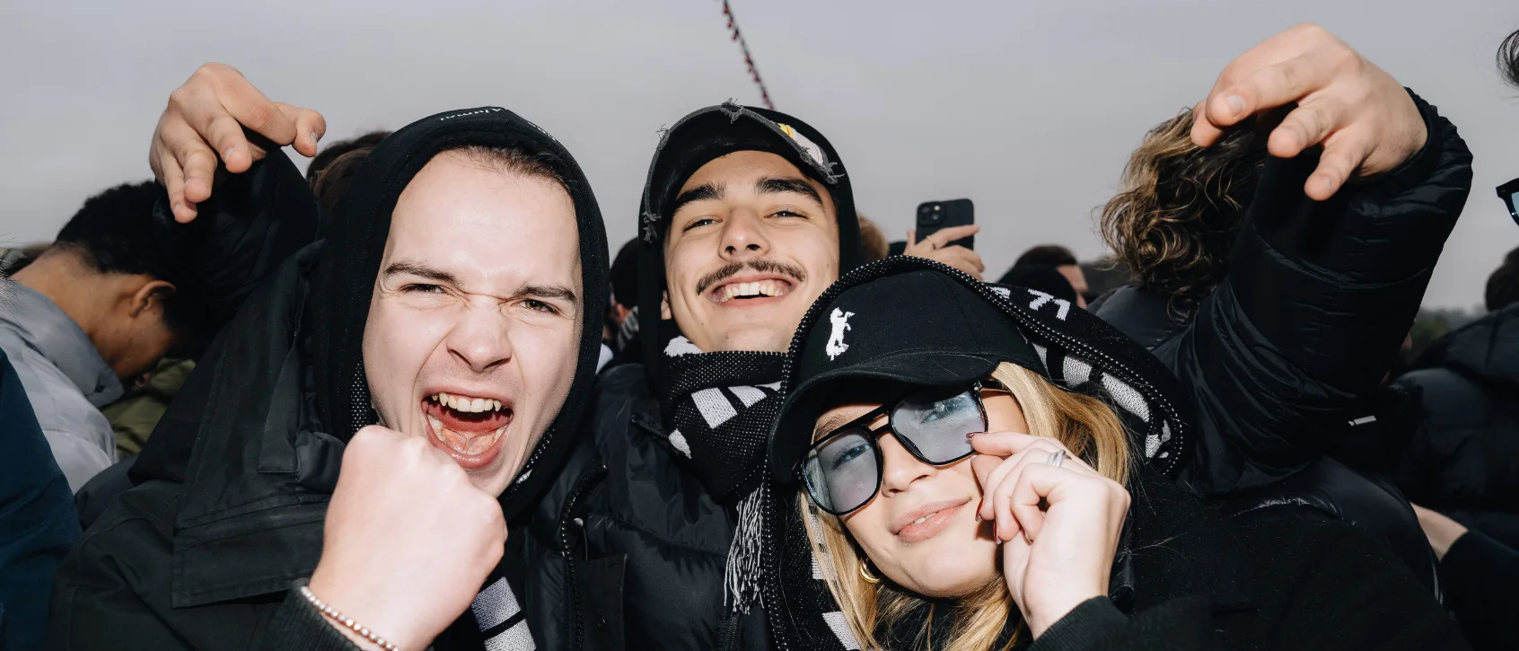 Spirit Elite: Hunters in black kit and striped scarves on the stands