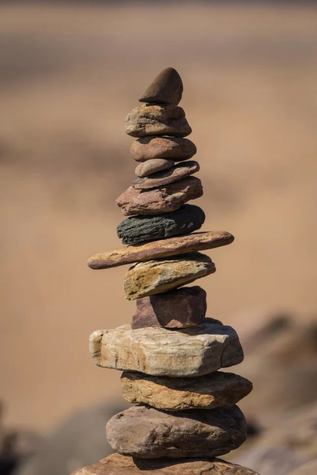 Balanced stone cairn in warm desert light