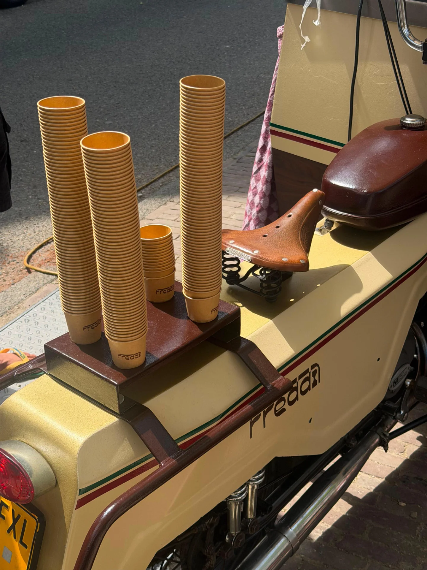 Stacks of printed Freddi cups on the cart